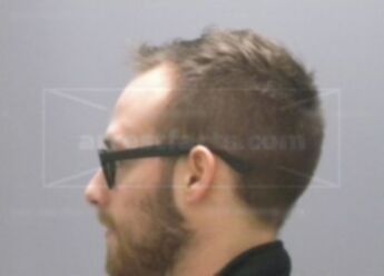 Adam J Mecomber
