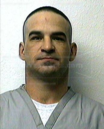 Travis J Hogner