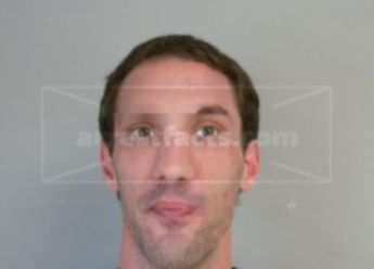 Travis J Wolfe