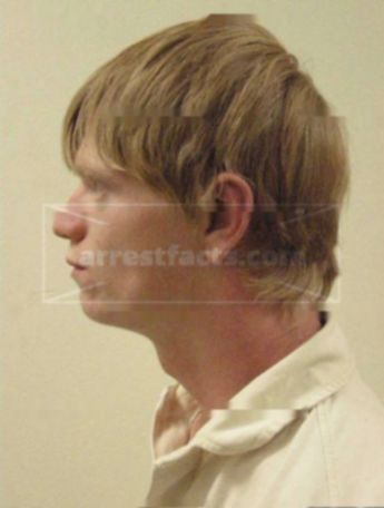 Travis J Genske