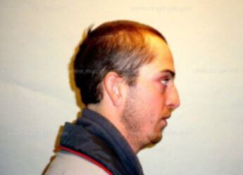 Travis J Nelson