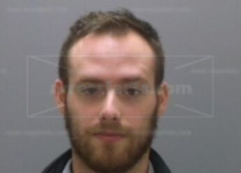Adam J Mecomber