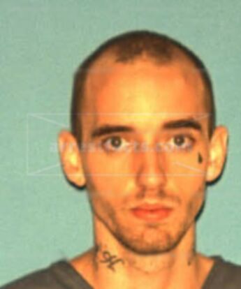 Travis L Houser