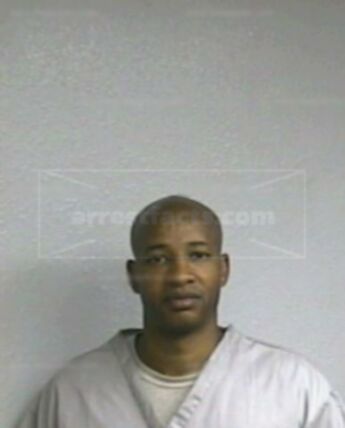 Travis L Huddlen