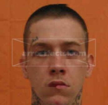 Travis J Brewer