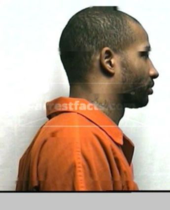 Travis L Huddlen