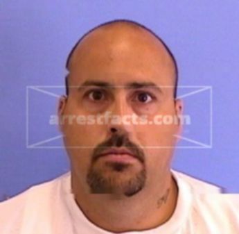 Travis E. Kness