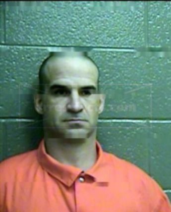 Travis J Hogner