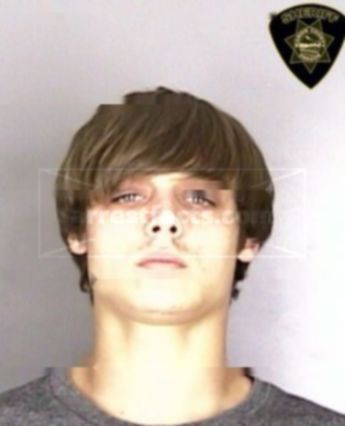 Aaron J Cade