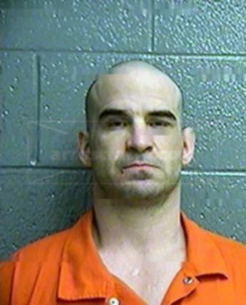 Travis J Hogner