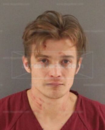 Aaron J Sexton