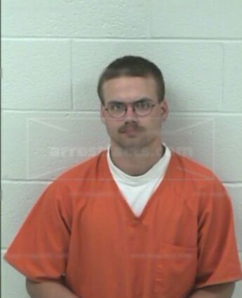 Travis J Mitchell