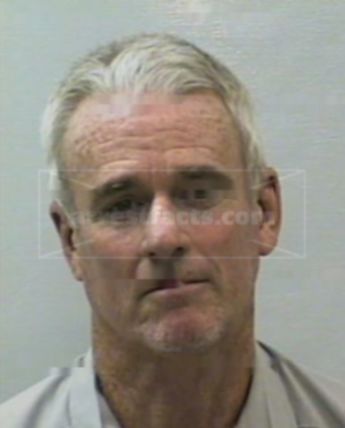 Mark E Brennan