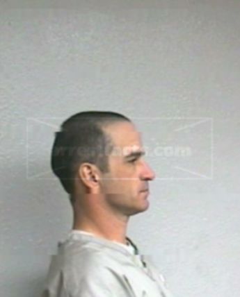 Travis J Hogner