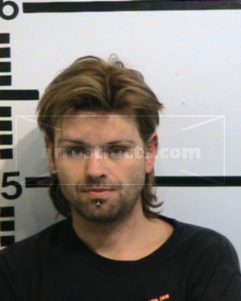 Travis Elmer Settles