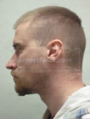 Justin T Olszewski