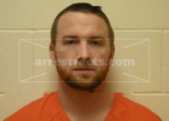 Travis J Freit
