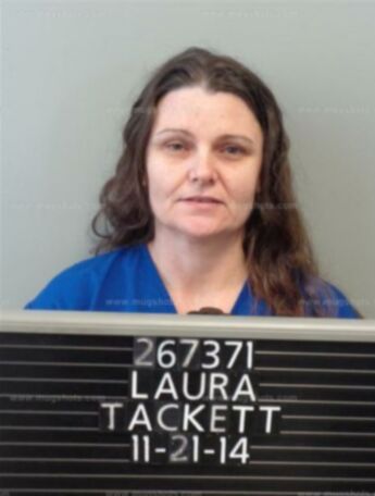 Laura M Tackett