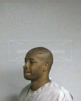 Travis L Huddlen