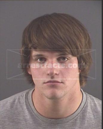 Tanner J Rhoades
