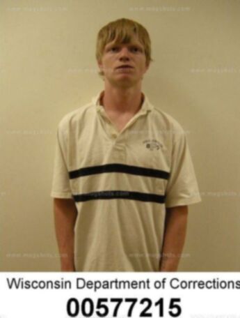 Travis J Genske