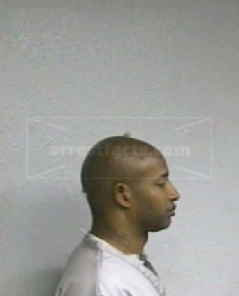 Travis L Huddlen