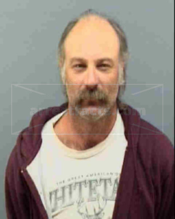 Mark L Flaugher