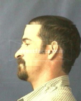 Travis J Hogner