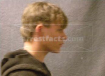 Travis J Bacholke