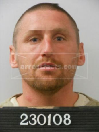 Travis J Riggs