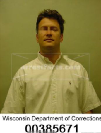 Brett J Belau