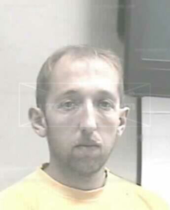 Travis James Holcomb