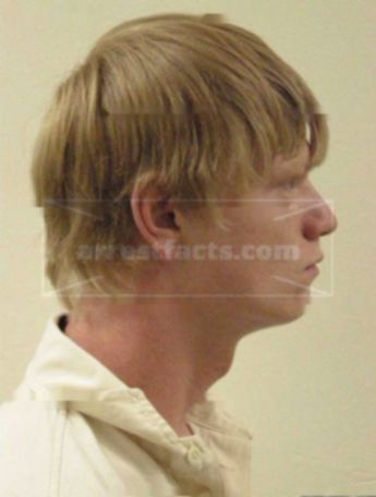 Travis J Genske